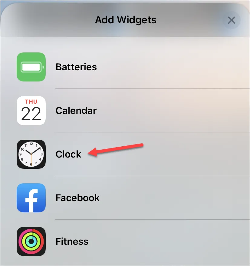 كيفية تغيير المدينة في القطعة على مدار الساعة على شاشة قفل iPhone 5